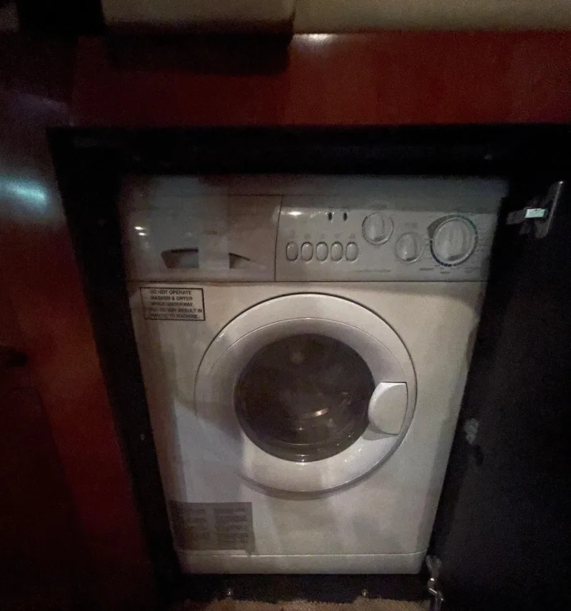 Slide: The Image of Washing machine inside 2005 Sea Ray 500 Sundancer yacht, wooden cabinetry. - 17