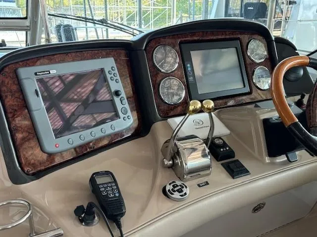 Slide: The Image of Helm of 2005 Sea Ray 500 Sundancer with navigation equipment and controls. - 19