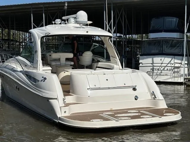 Slide: The Image of 2005 Sea Ray 500 Sundancer yacht docked in marina, rear view. - 2