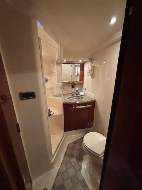 Slide: The Image of Luxurious bathroom in 2005 Sea Ray 500 Sundancer yacht with shower, sink, and toilet. - 30