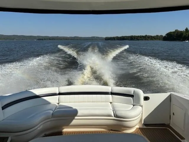 Slide: The Image of 2005 Sea Ray 500 Sundancer cruising on a lake, view from the rear seating area. - 35