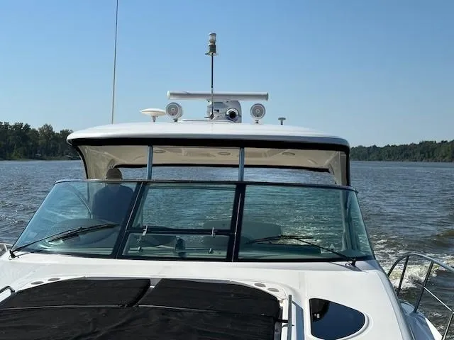 Slide: The Image of 2005 Sea Ray 500 Sundancer cruising on a calm lake under clear skies. - 38