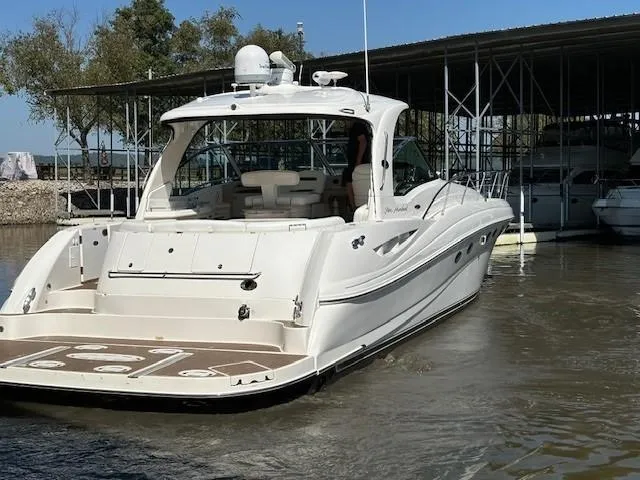 Slide: The Image of 2005 Sea Ray 500 Sundancer yacht docked in marina, rear view. - 49