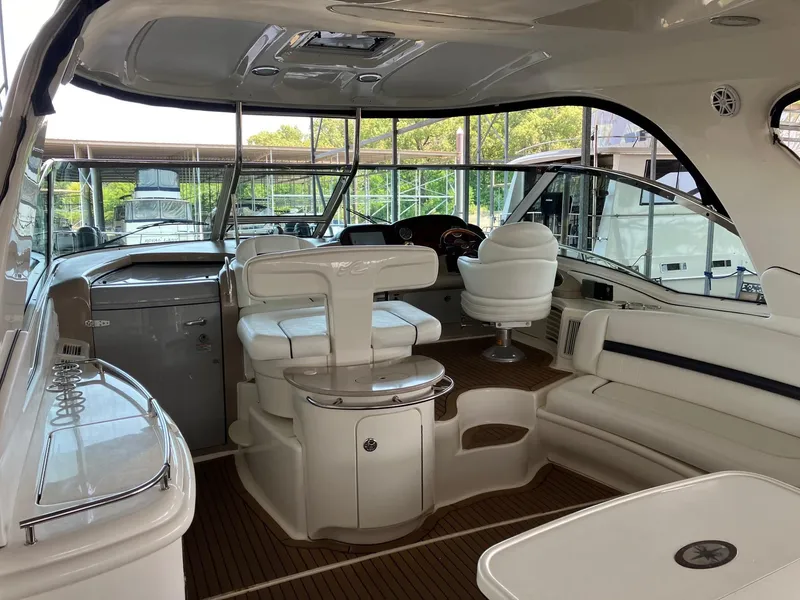Slide: The Image of Interior of a 2005 Sea Ray 500 Sundancer yacht with luxurious seating and helm. - 5