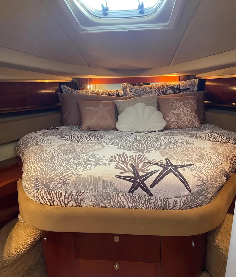 Slide: The Image of Luxurious cabin interior of 2005 Sea Ray 500 Sundancer yacht with elegant bedding. - 7