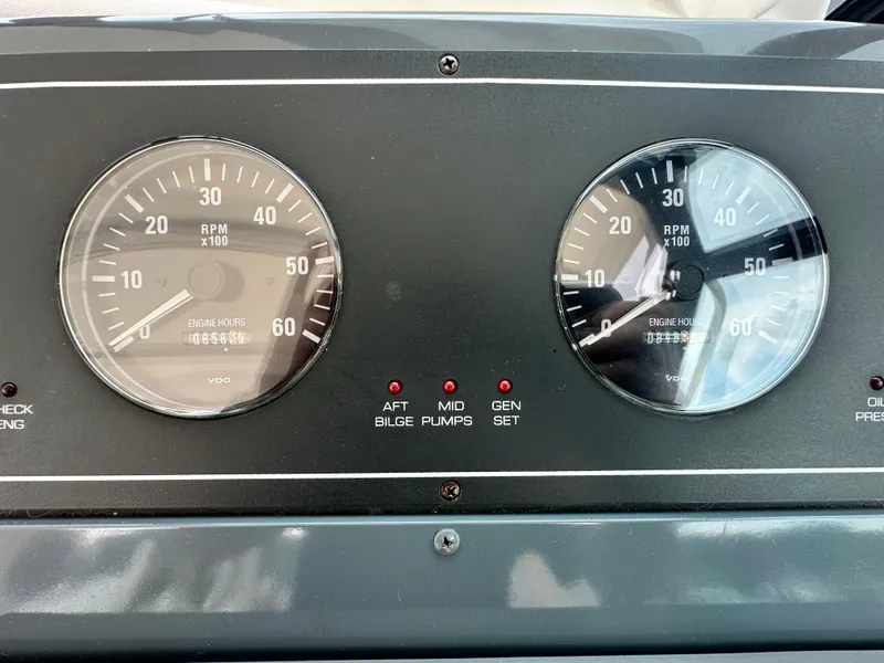 Slide: The Image of Dashboard of 2003 Tiara Yachts 3100 Open showing RPM gauges and engine hours. - 10