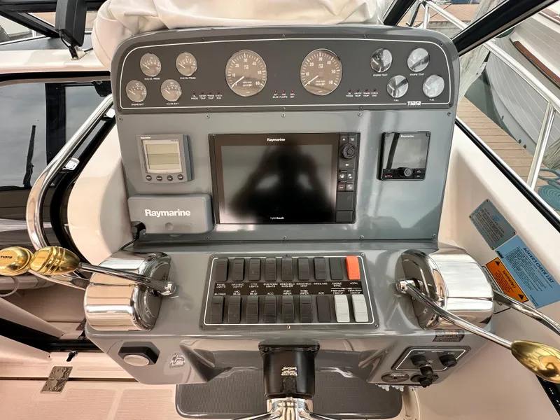 Slide: The Image of Control panel of a 2003 Tiara Yachts 3100 Open with Raymarine navigation system. - 11