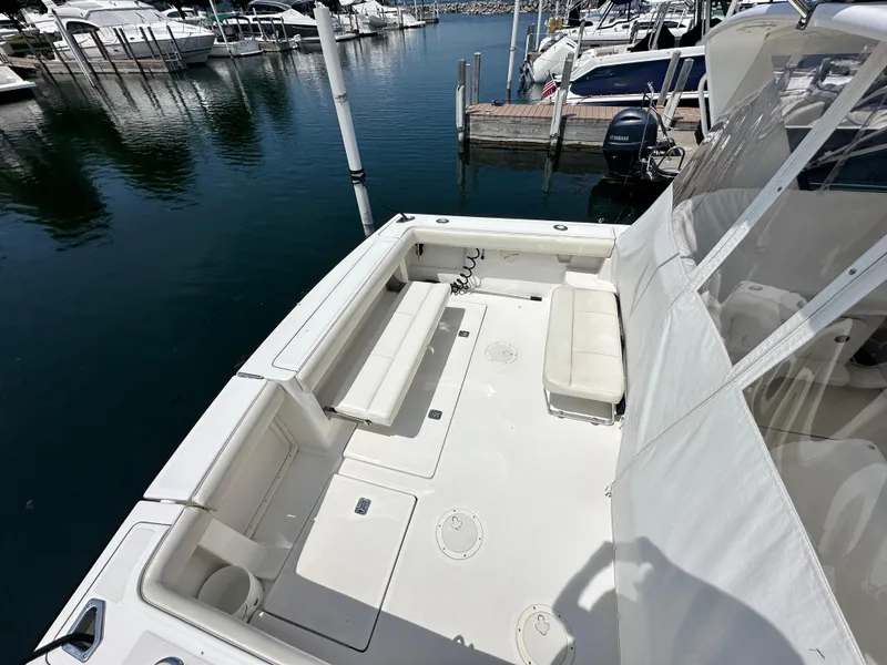 Slide: The Image of 2003 Tiara Yachts 3100 Open boat with spacious deck, docked at marina. - 20