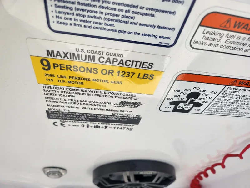 Slide: The Image of 2023 Tahoe T18 boat capacity label, 9 persons or 1237 lbs, 115 HP motor. - 12
