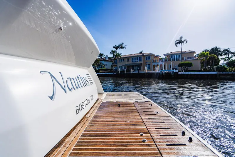 Slide: The Image of Beneteau GRAN TURISMO 49 yacht docked near waterfront homes, sunny day, 2016 model. - 21