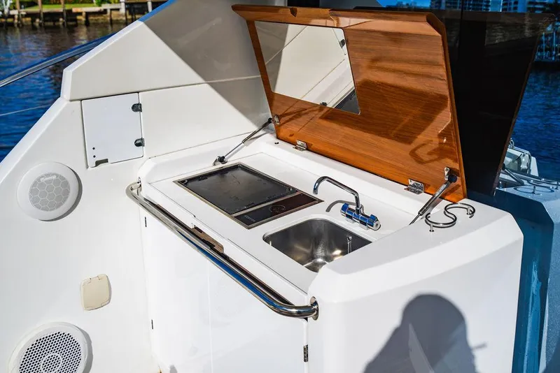 Slide: The Image of Beneteau Gran Turismo 49 yacht kitchenette with sink and stove, 2016 model. - 26