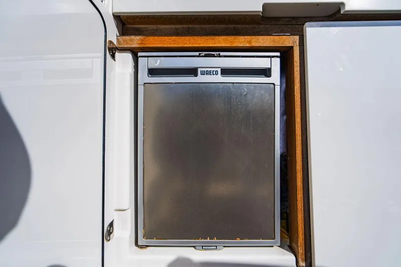 Slide: The Image of Built-in Waeco fridge on 2016 Beneteau Gran Turismo 49 yacht. - 29