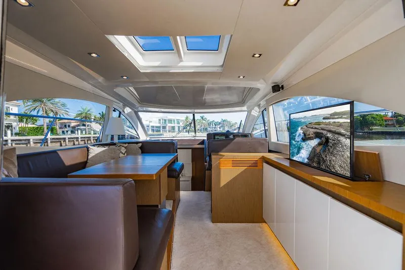 Slide: The Image of Luxurious interior of 2016 Beneteau Gran Turismo 49 yacht with modern seating and large windows. - 43