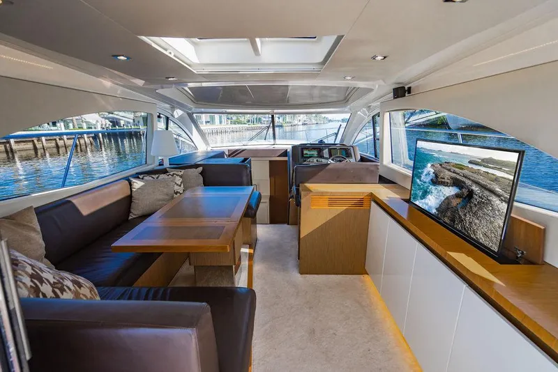 Slide: The Image of Luxurious interior of 2016 Beneteau Gran Turismo 49 yacht with modern seating and TV. - 44
