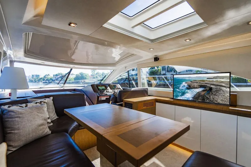 Slide: The Image of Luxurious interior of 2016 Beneteau Gran Turismo 49 yacht with modern seating and skylight. - 45