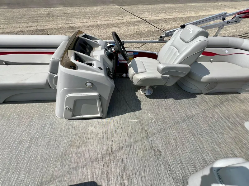 Slide: The Image of 2023 Bennington 20 SVSR boat interior with steering console and seating. - 12