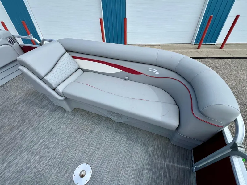 Slide: The Image of 2023 Bennington 20 SVSR pontoon boat with stylish gray seating and red accents. - 14