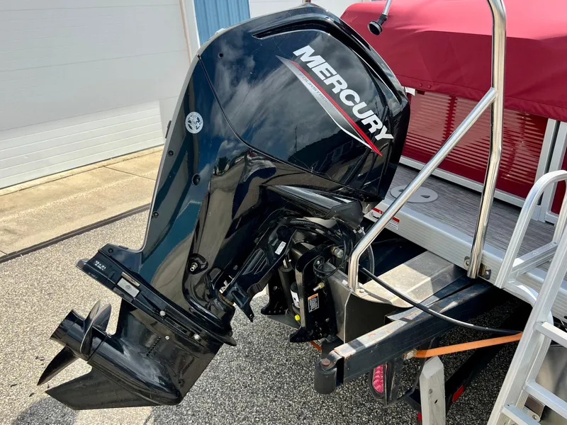 Slide: The Image of 2023 Bennington 20 SVSR with Mercury outboard motor, red canopy, and aluminum ladder. - 5