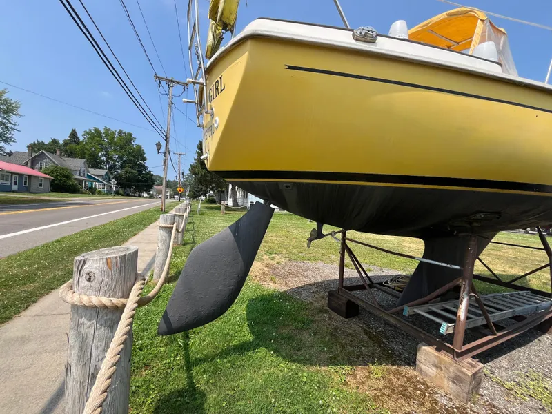 Slide: The Image of Yellow 1980 Pearson 30 sailboat on a stand. - 10