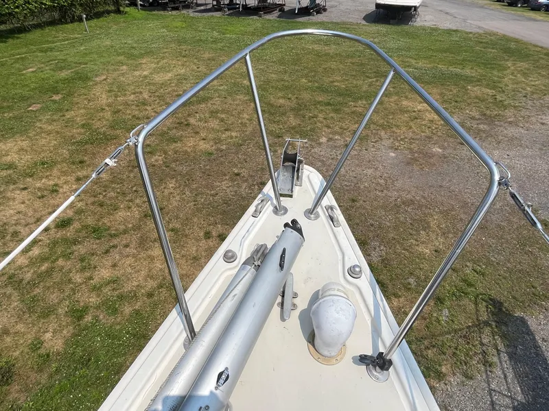 Slide: The Image of Bow view of a 1980 Pearson 30 yacht on grass. - 12