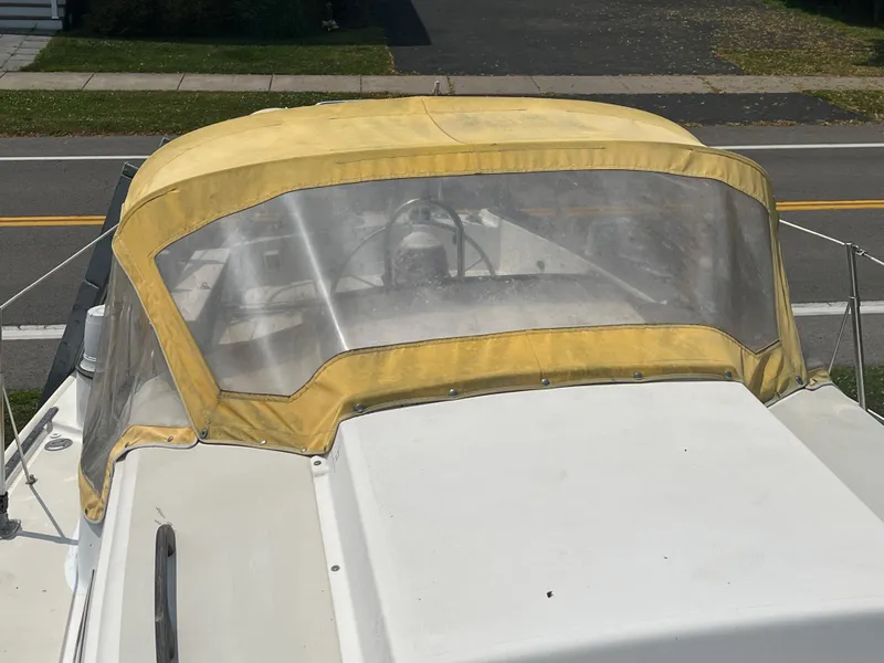 Slide: The Image of 1980 Pearson 30 sailboat with yellow canopy. - 14