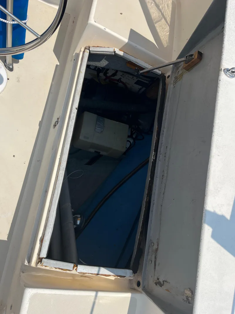 Slide: The Image of Open storage compartment on a 1980 Pearson 30 sailboat. - 22