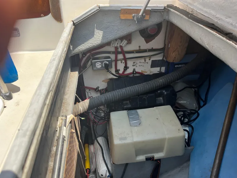 Slide: The Image of Interior view of a 1980 Pearson 30 sailboat with electrical components. - 23
