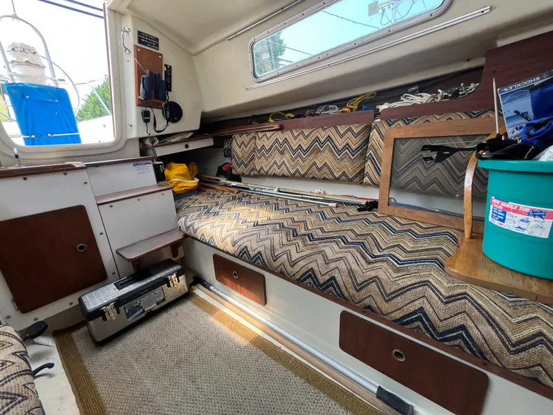 Slide: The Image of Interior of a 1980 Pearson 30 yacht with patterned upholstery. - 29