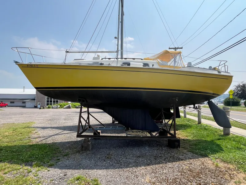 Slide: The Image of Yellow 1980 Pearson 30 sailboat on a stand. - 4