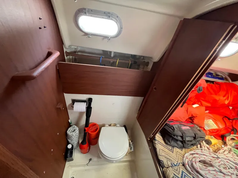 Slide: The Image of Interior of a 1980 Pearson 30 yacht with toilet and storage area. - 42
