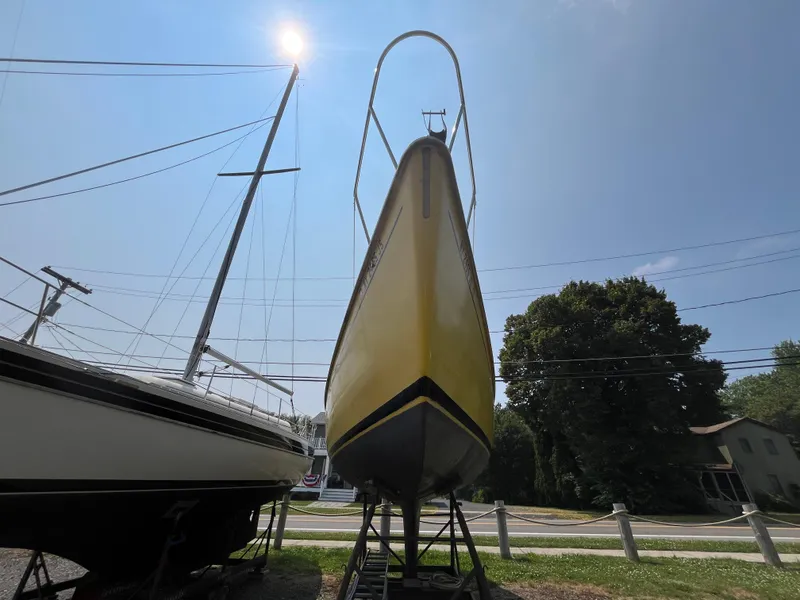 Slide: The Image of Yellow 1980 Pearson 30 sailboat on a stand. - 5