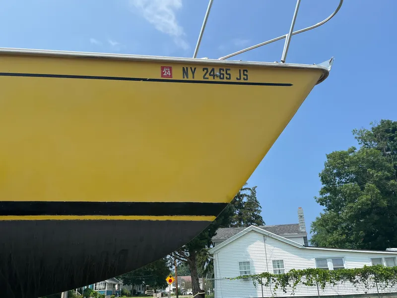 Slide: The Image of Yellow 1980 Pearson 30 boat with registration number. - 7