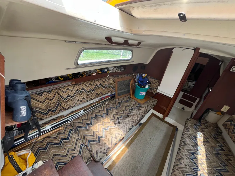 Slide: The Image of Interior of a 1980 Pearson 30 yacht with patterned upholstery. - 31