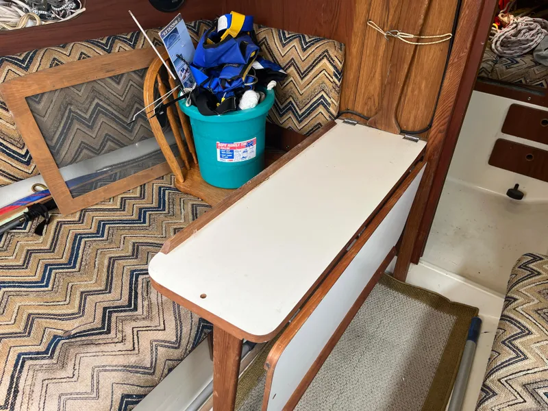 Slide: The Image of Interior of a 1980 Pearson 30 sailboat with storage area. - 34