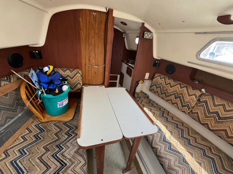 Slide: The Image of Interior of a 1980 Pearson 30 yacht with seating area. - 35