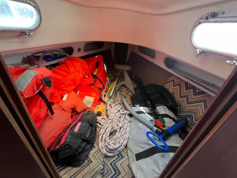 Slide: The Image of Interior of a Pearson 30 yacht with gear and life jackets. - 44