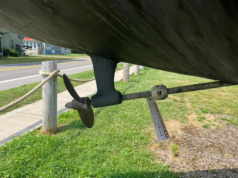 Slide: The Image of Propeller of a 1980 Pearson 30 sailboat on grass. - 9