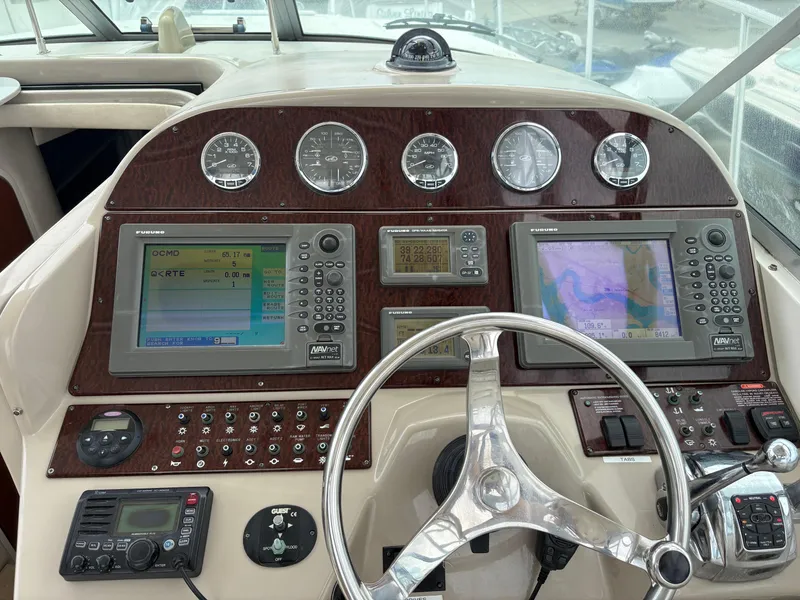 Slide: The Image of 2008 Sea Ray 290 Amberjack dashboard with navigation and control systems. - 11
