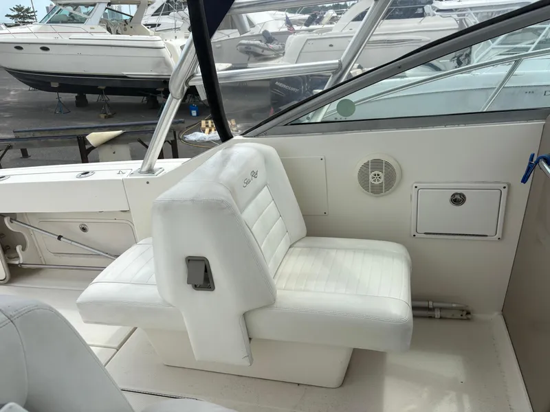 Slide: The Image of 2008 Sea Ray 290 Amberjack interior with white seating and dashboard view. - 15
