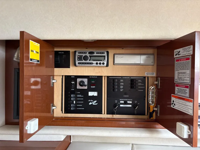 Slide: The Image of 2008 Sea Ray 290 Amberjack control panel with stereo and electrical switches. - 28