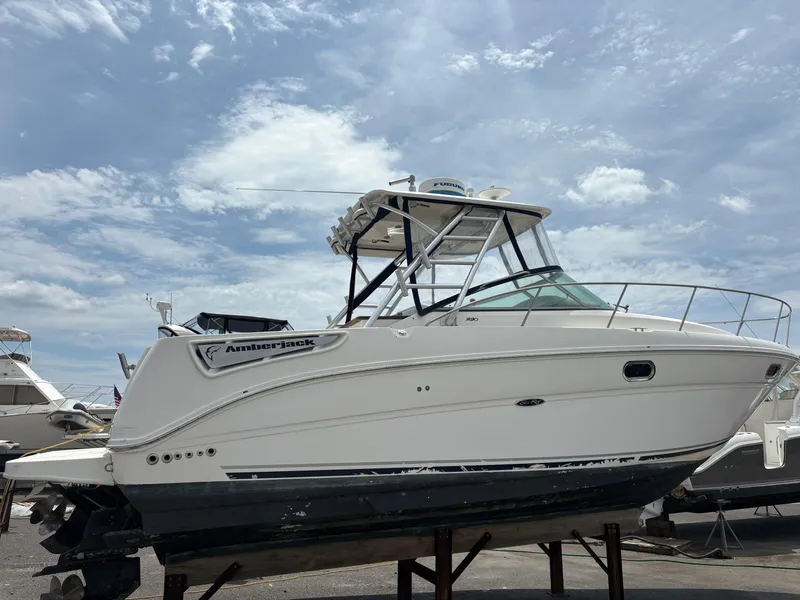 Slide: The Image of 2008 Sea Ray 290 Amberjack boat on display under a cloudy sky. - 3
