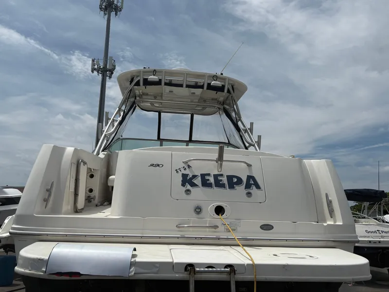 Slide: The Image of 2008 Sea Ray 290 Amberjack boat docked under cloudy sky. - 4