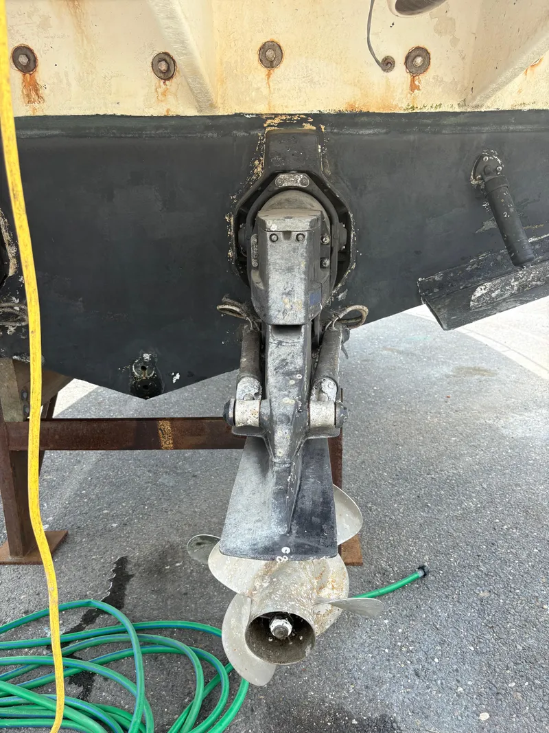 Slide: The Image of 2008 Sea Ray 290 Amberjack boat stern with propeller and visible wear. - 5