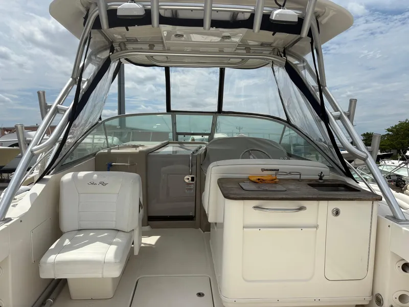 Slide: The Image of 2008 Sea Ray 290 Amberjack boat interior with seating and helm station. - 7