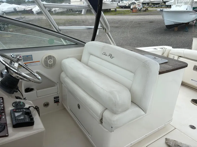 Slide: The Image of 2008 Sea Ray 290 Amberjack helm with white seating and steering wheel. - 8