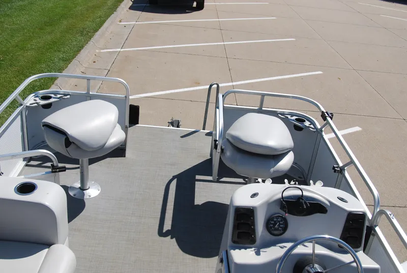 Slide: The Image of 2016 Apex Marine QUEST 7516 pontoon boat interior with seating and steering console. - 10