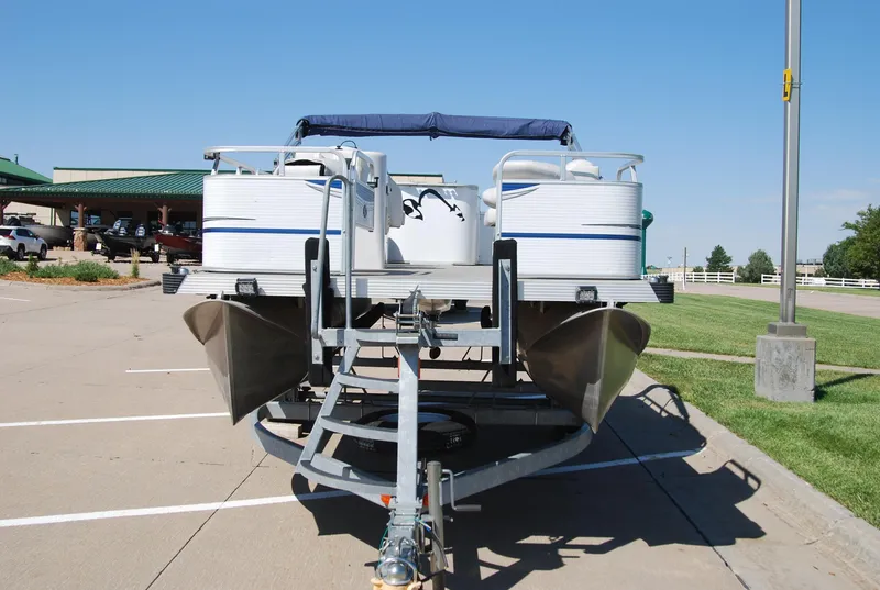 Slide: The Image of 2016 Apex Marine QUEST 7516 pontoon boat on trailer in parking lot. - 4