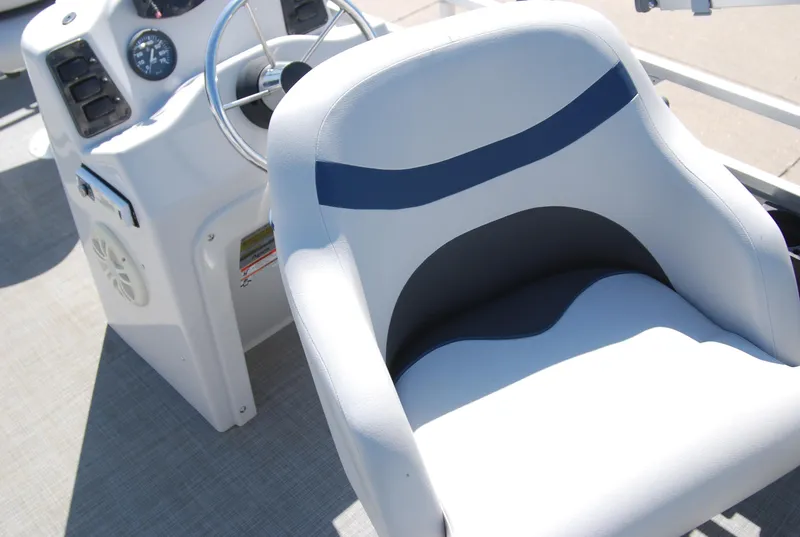 Slide: The Image of 2016 Apex Marine QUEST 7516 boat helm with steering wheel and cushioned seat. - 6