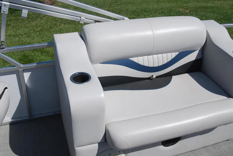 Slide: The Image of 2016 Apex Marine QUEST 7516 boat seat with cup holder, featuring sleek gray and blue design. - 8