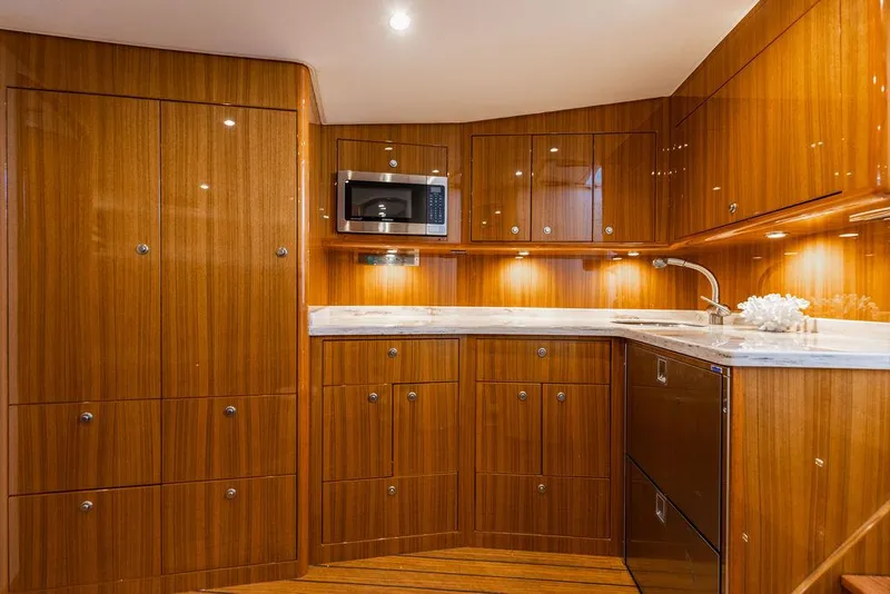 Slide: The Image of Luxurious wooden kitchen interior of 2020 Viking 46 Billfish yacht with modern amenities. - 12
